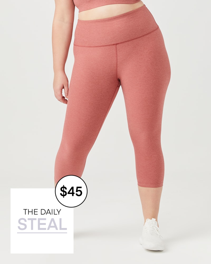 Plus size model with hourglass body shape wearing Canal Capri Legging by Beyond Yoga | Dia&Co | dia_product_style_image_id:158634